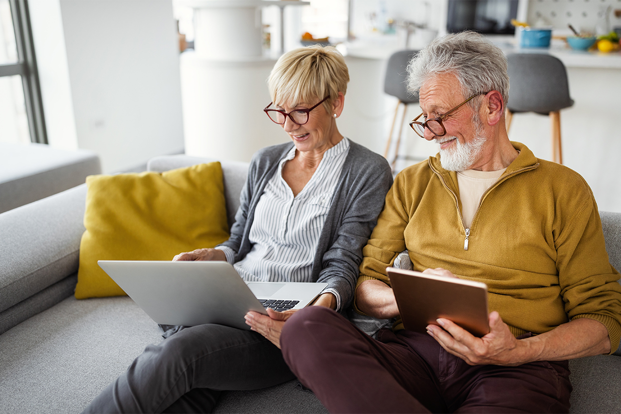 Happy senior couple hugging and enjoying retirement at home